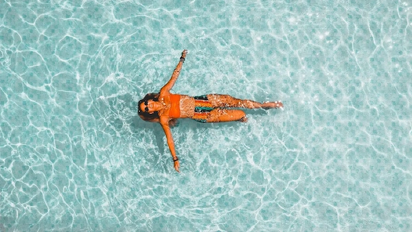 Crystal clear swimming pool at a luxury villa managed by Empyrean Listings